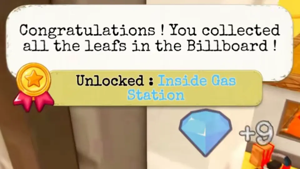 A close-up of the game's message: Congratulations! You collected all the leafs in the Billboard! Below it: Unlocked: Inside Gas Station, and a blue gem with +9.
